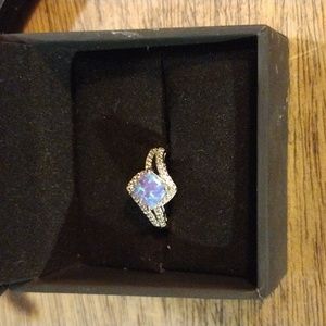 Lavender lab created opal and White lab created Sapphire Silver ring.